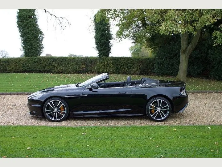 Sleek side profile of the Aston Martin DBS, showcasing its elegant design.