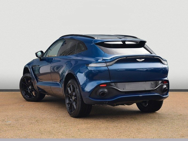 A sleek Aston Martin DBX luxury SUV parked outdoors, showcasing its elegant design