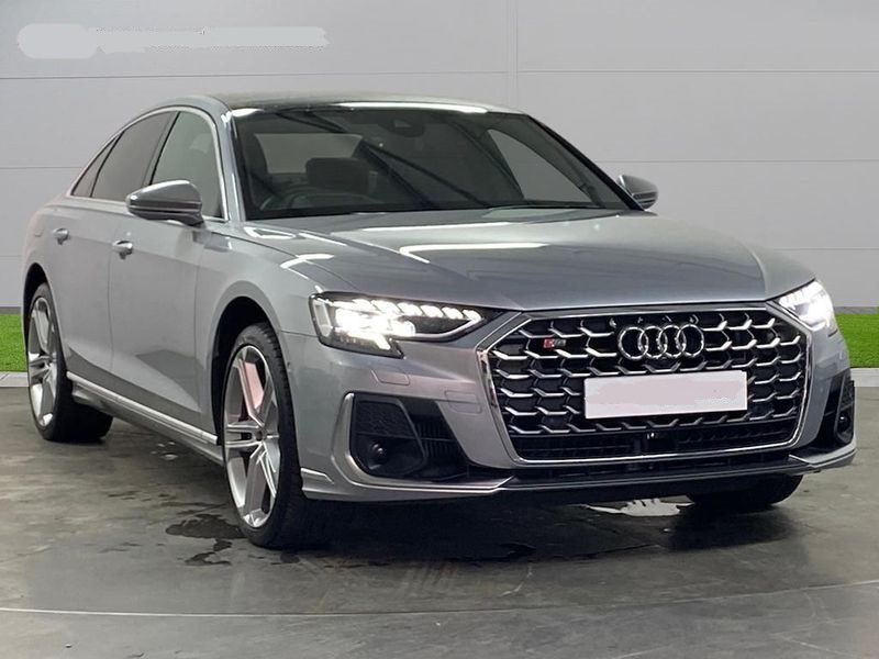 Spacious and luxurious rear interior of the Audi S8 hire car.