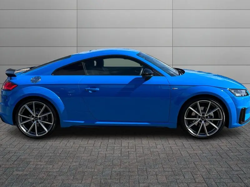 A sleek grey Audi TT Sports Car parked.