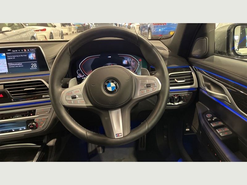 Side profile of a sleek, modern BMW 7 Series.