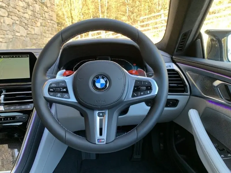 Side profile of the BMW M8 Series, ready for renting.