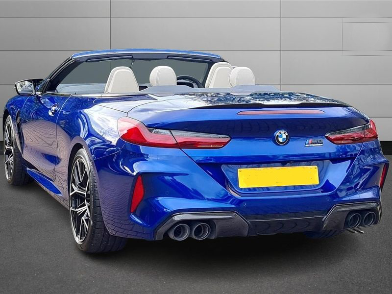 A sleek, grey BMW M8 Series parked, showcasing its design.