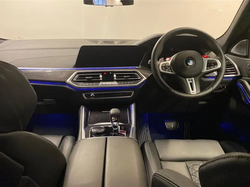 A sleek black BMW X6M parked showcasing its coupe-like roofline.