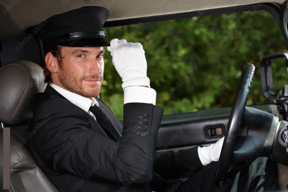 Professional chauffeur opening the door of a luxury vehicle.