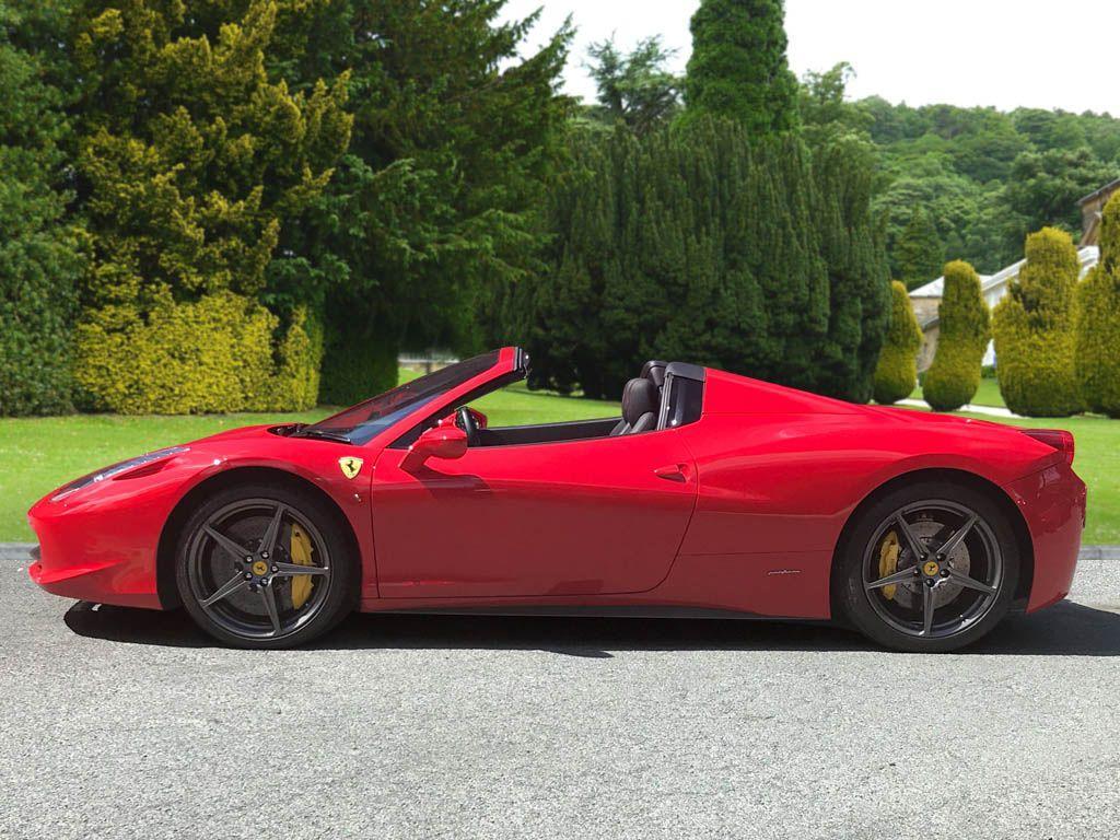 A Ferrari 458 Italia Spyder ready for self-drive hire on a sunny day.