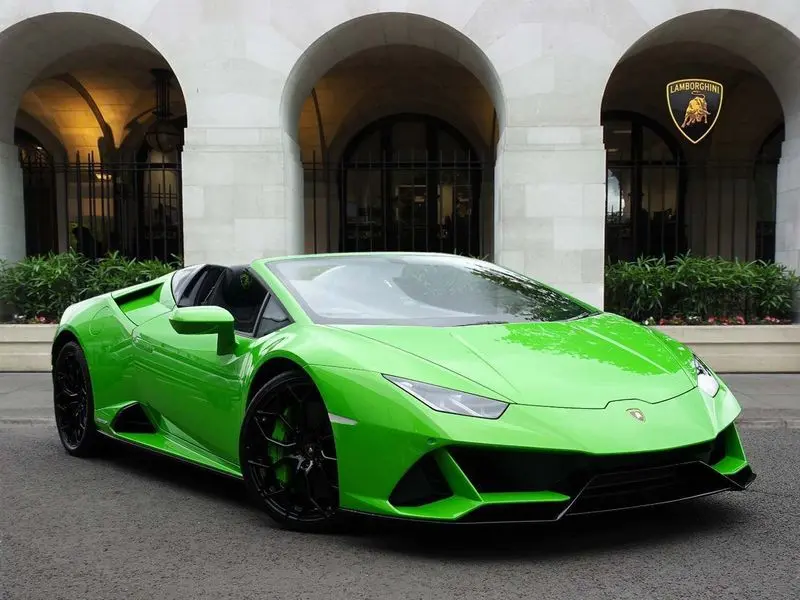 A green Lamborghini Huracan used in a music video production.