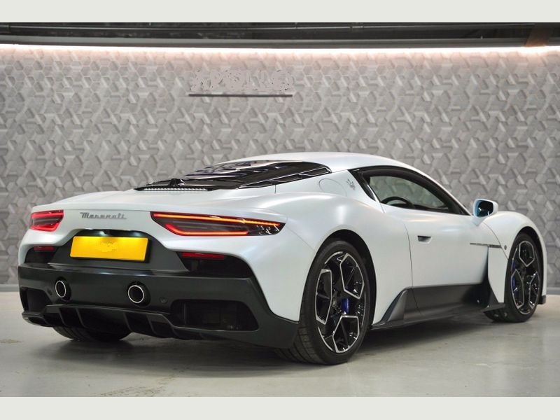 A white Maserati MC20 showcasing its luxury car hire appeal.