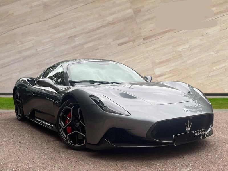 Close-up on the wheel of a Maserati MC20, highlighting the self-drive experience.