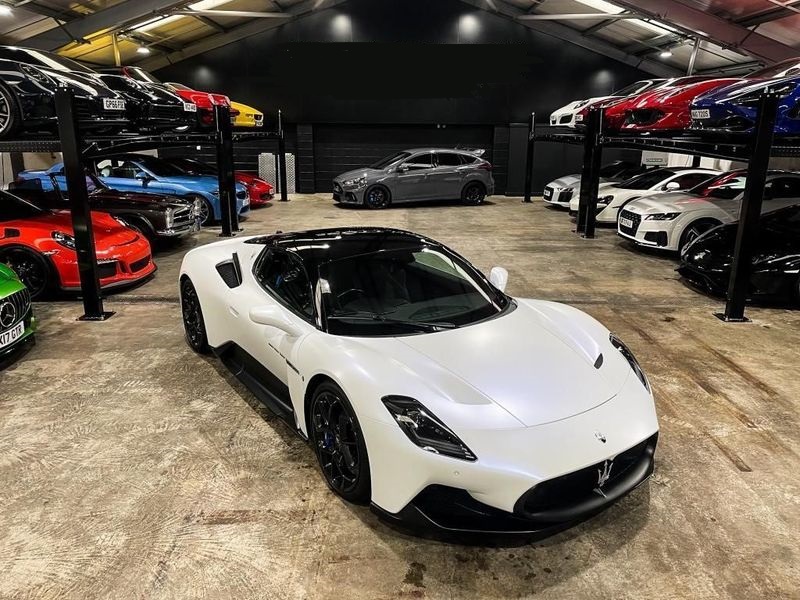 A stunning white Maserati MC20 available for sports car hire.