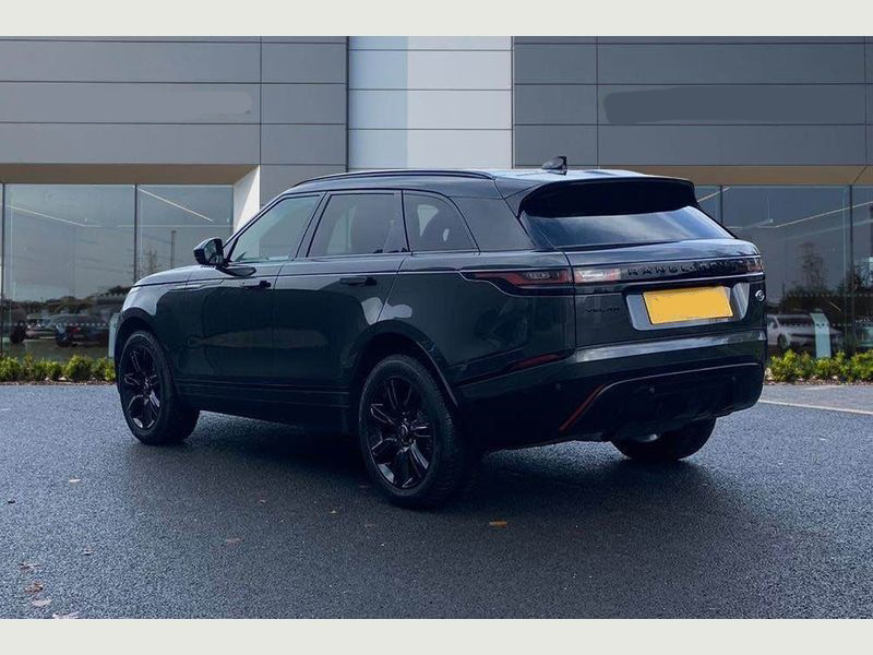 A sleek black Range Rover Velar available for hire.